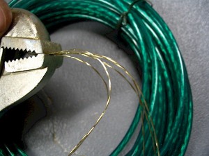 Green vinyl-coated clothesline was stripped and used as the strings for our bowed psaltery