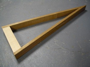 A loose layout of the psaltery's frame, still unglued