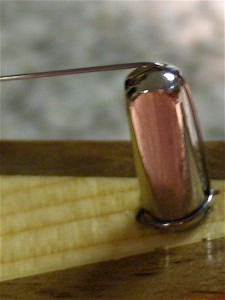 A notch is filed in the top of the hitch pin to allow a smooth curve for the string's path