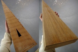 Front and back views of the psaltery after pore-filling and sanding