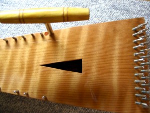 A tuning wrench can be used to help show the trajectory of the string