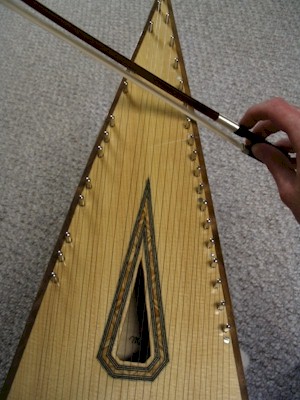 The bowed psaltery is played along the sides